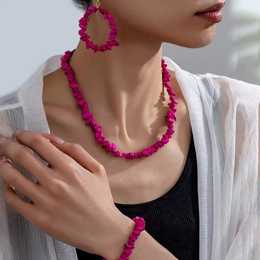Woman wearing a boho long necklace made from the 80cm crushed stone base kit on a nylon cord.