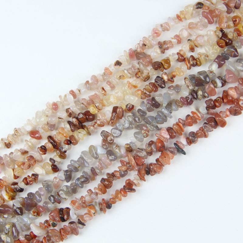 A variety of natural agate chip bead strands in different earthy colors, showcasing the available options for jewelry making and DIY crafts.