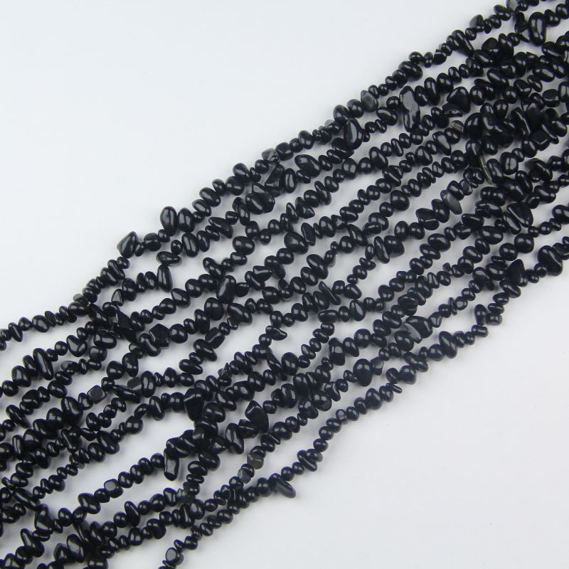 31.5 inch black obsidian irregular bead necklace laid flat on white background