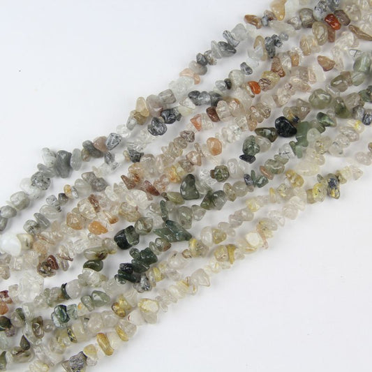 4 colors of natural rutilated quartz chip bead strands: black, copper, golden, and green. 31.5 inch gemstones with unique hair-like inclusions, perfect for jewelry making.