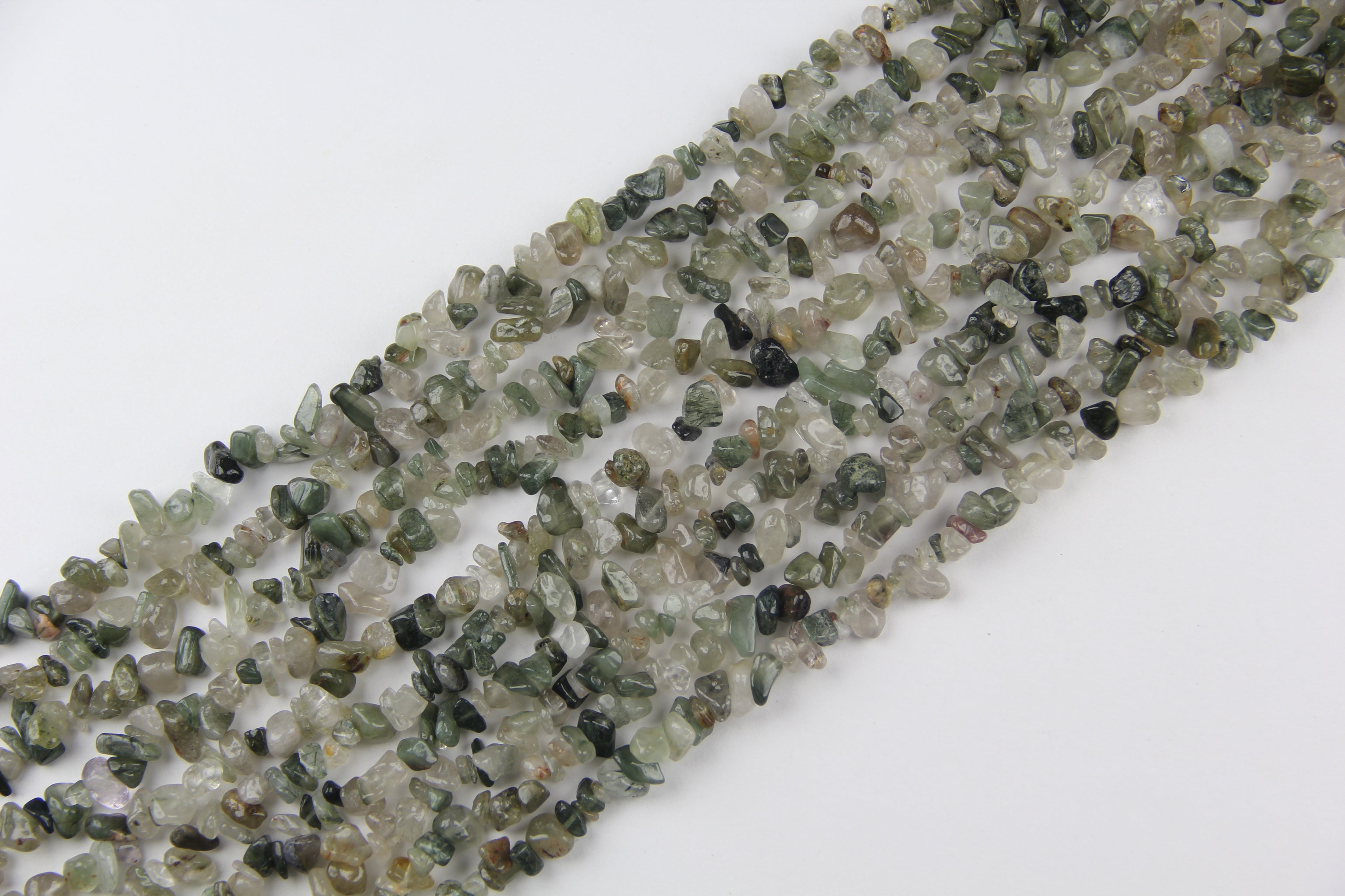 Irregular long chain of green hair crystals