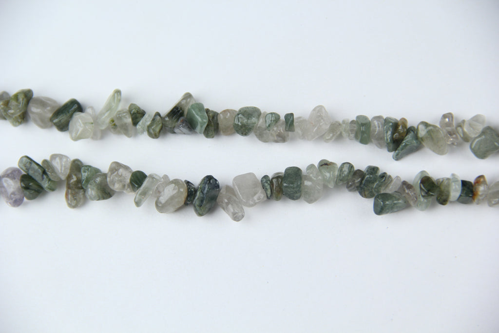 Irregular long chain of green hair crystals