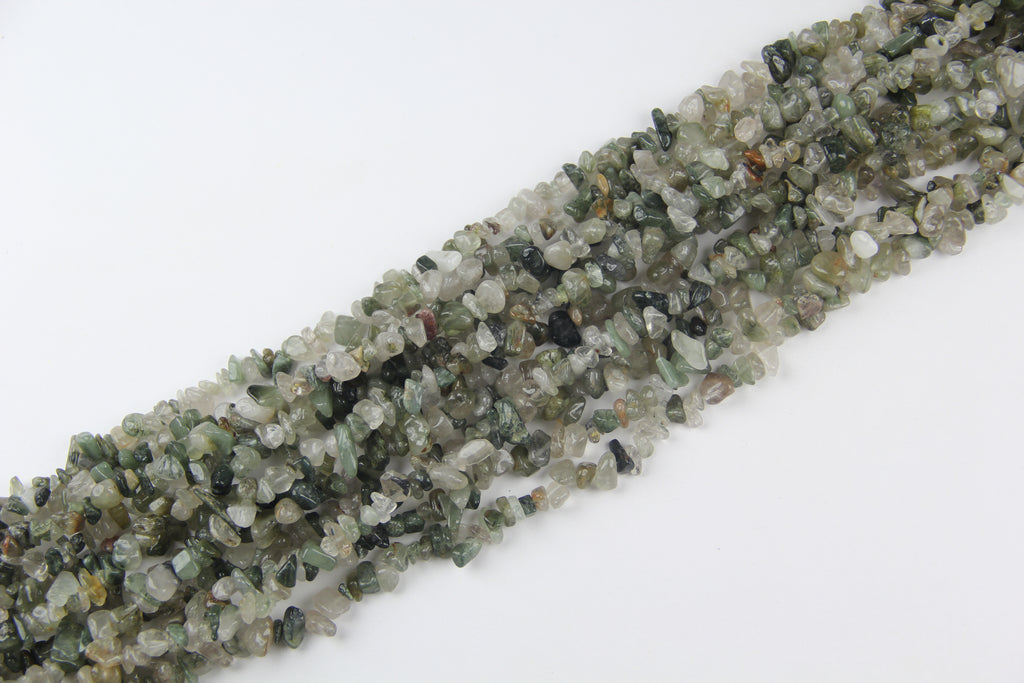 Irregular long chain of green hair crystals