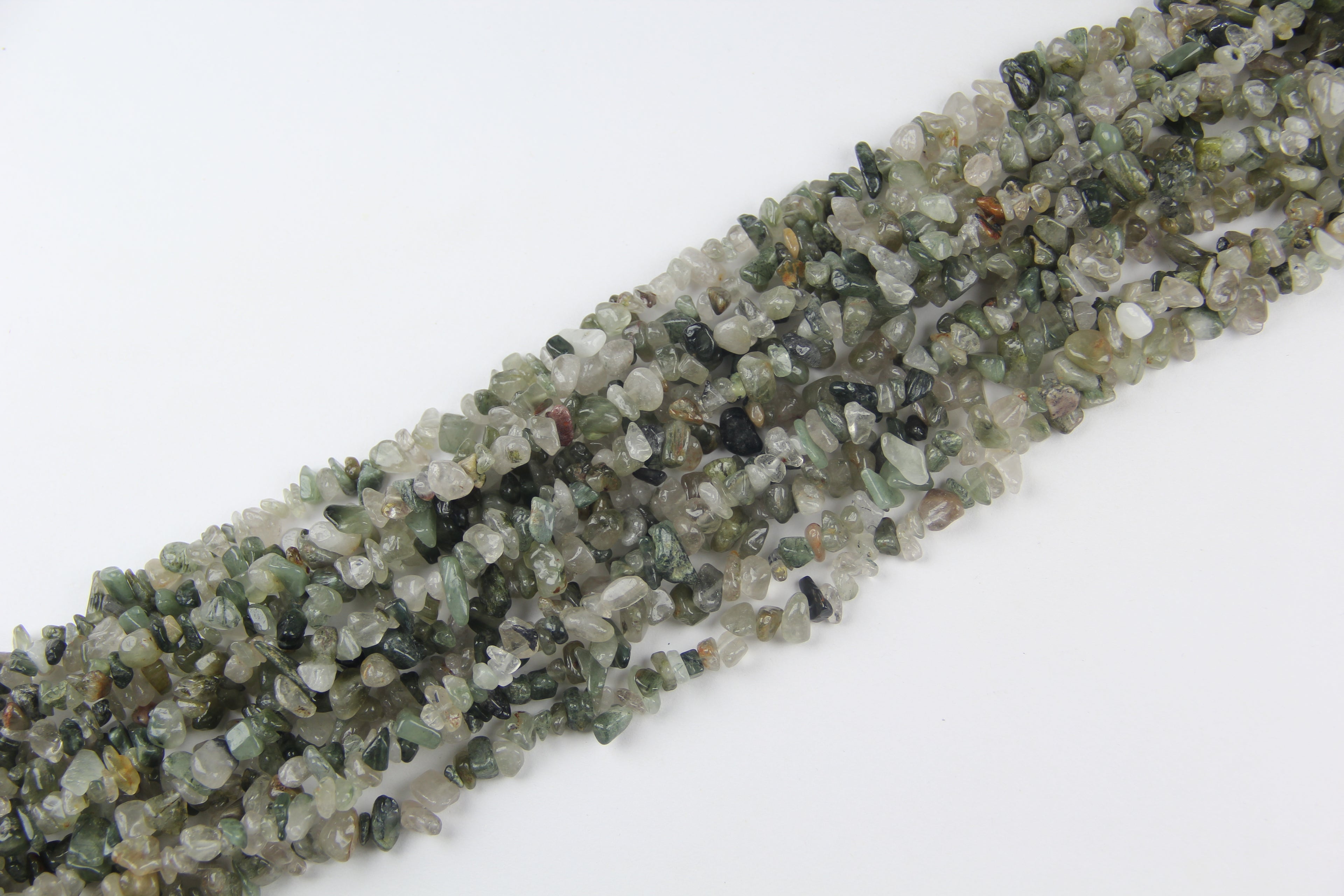 Irregular long chain of green hair crystals