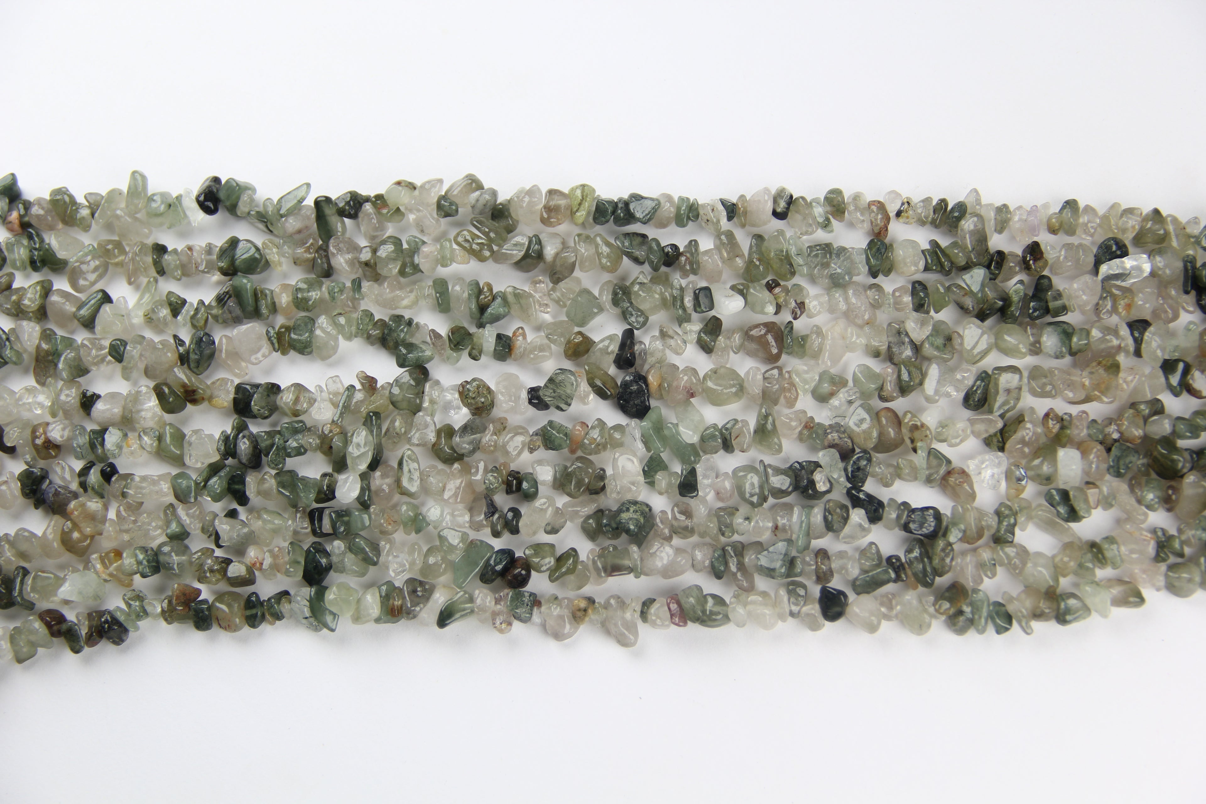Irregular long chain of green hair crystals