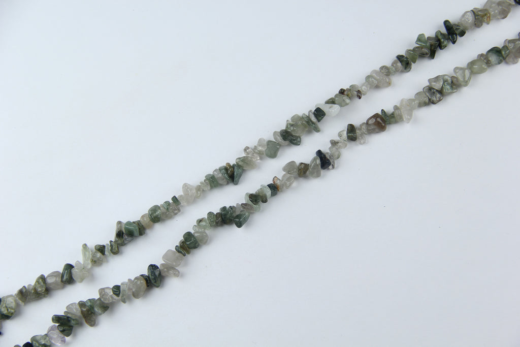 Irregular long chain of green hair crystals