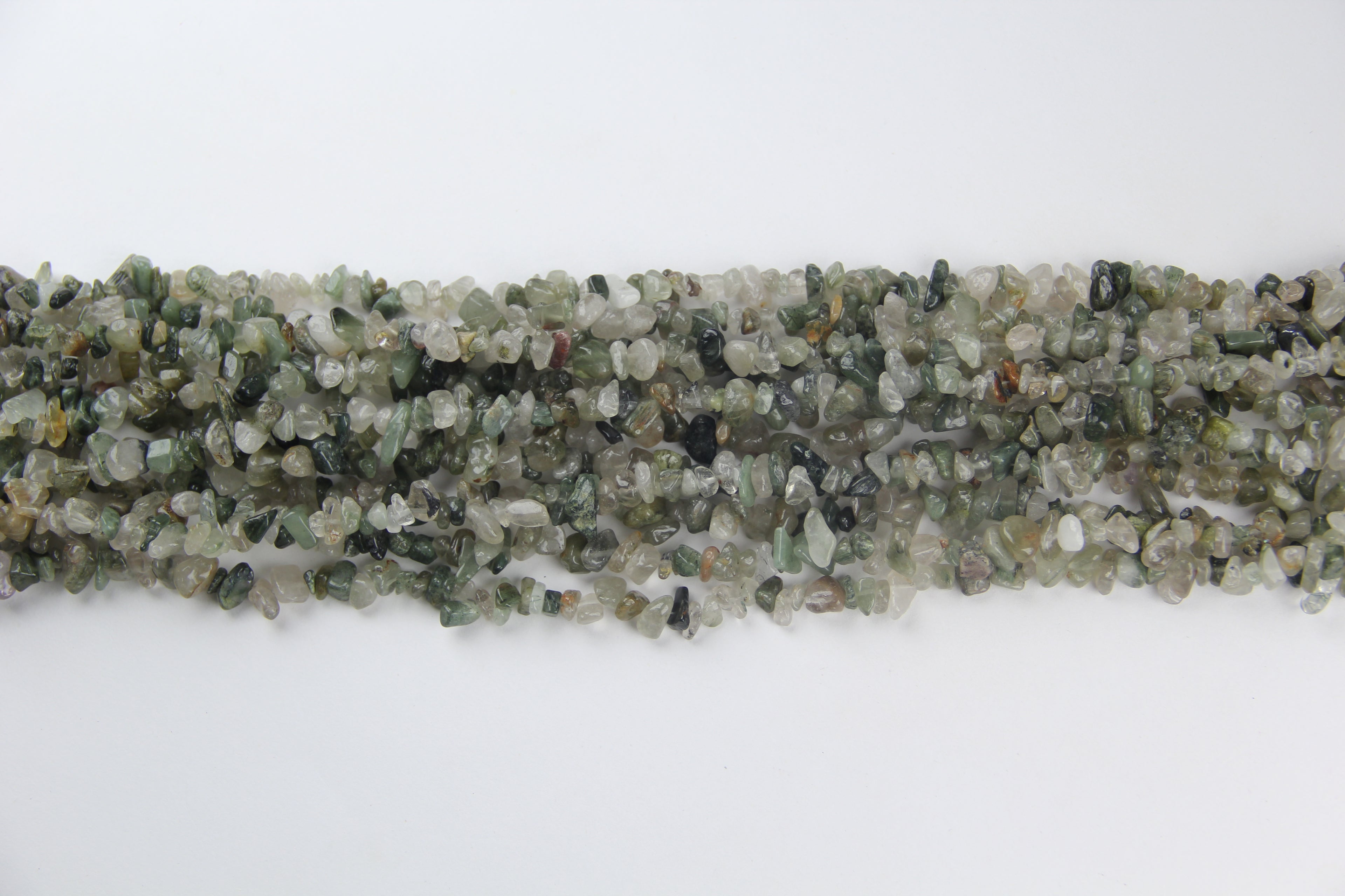 Irregular long chain of green hair crystals