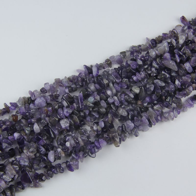 stacked coils of amethyst bead strand, 31.5 inches long, irregular round 5-8mm beads on nylon cord