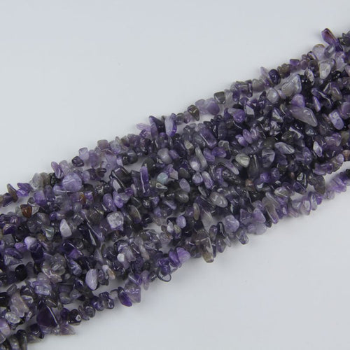 stacked coils of amethyst bead strand, 31.5 inches long, irregular round 5-8mm beads on nylon cord