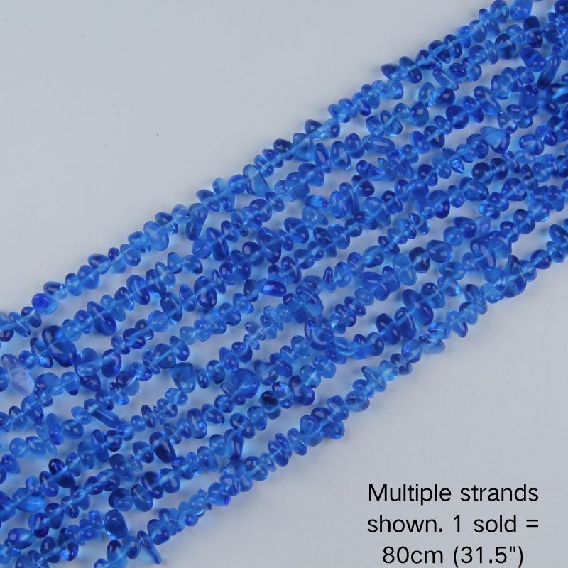 Multiple strands of 31.5" blue irregular glass chip beads (5-8mm) displayed on a white background. Note: 1 strand sold per order, measuring 80cm (31.5").