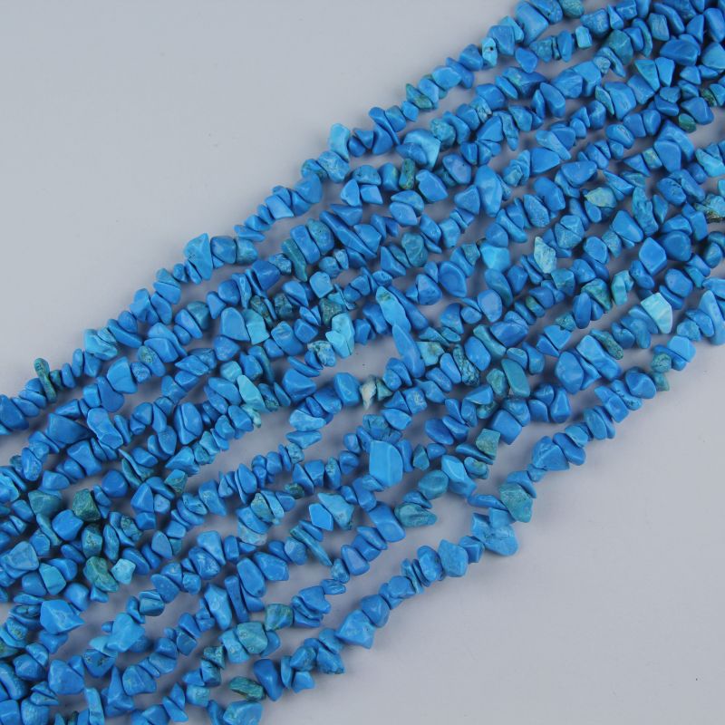 31.5 inch natural blue turquoise bead strand with 5-8mm irregular round beads and dark matrix veining threaded on nylon cord