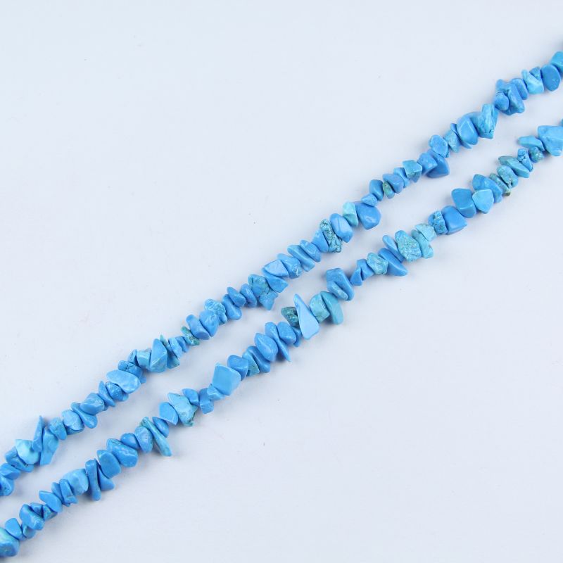 single flat lay of blue turquoise necklace strand, 31.5 inches, 5-8mm irregular round beads strung on nylon cord
