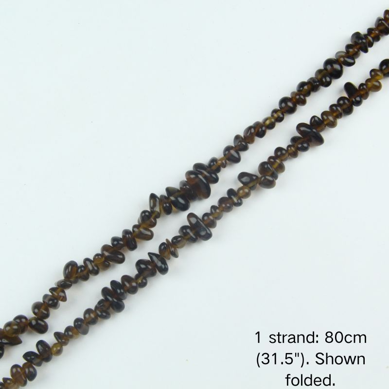 A single 80cm (31.5") strand of brown irregular glass chip beads, shown folded to display the actual length and nylon cord threading.