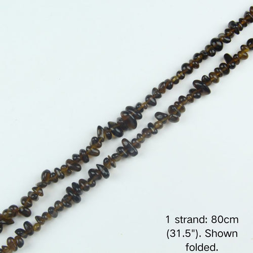 A single 80cm (31.5") strand of brown irregular glass chip beads, shown folded to display the actual length and nylon cord threading.