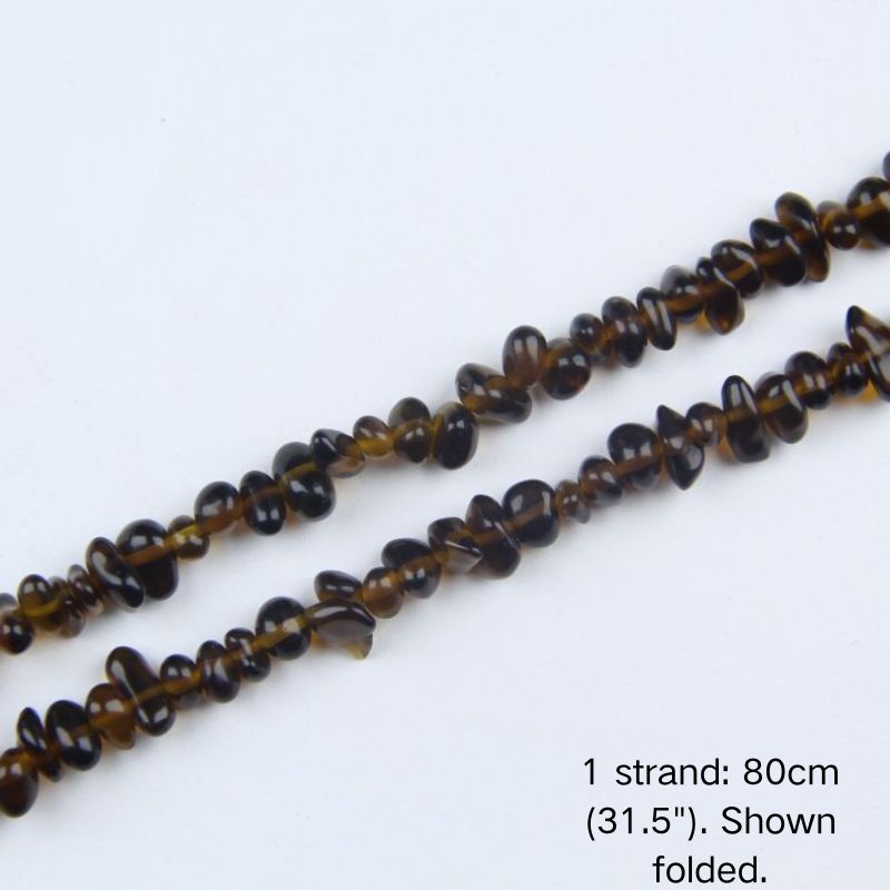 Macro close-up of glossy brown 5-8mm irregular glass chip beads, showcasing the polished texture, translucency, and center-drilled holes.