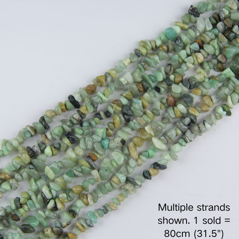 Multiple strands of natural Amazonite irregular chip beads laid out flat, 31.5 inches long, displaying a mix of seafoam green and white tones.