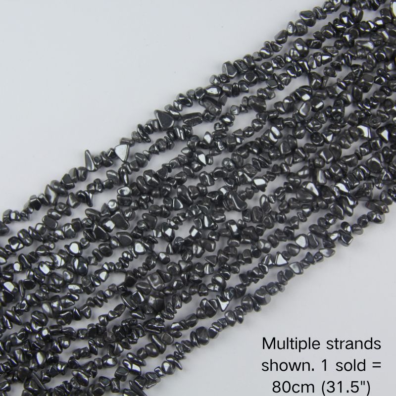 Multiple strands of natural black Hematite metallic chip beads laid out flat, each 31.5 inches long and 5-8mm in size, perfect for bulk DIY jewelry making supplies.