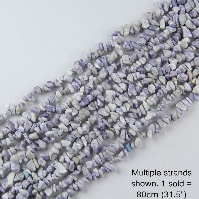 Multiple strands of natural purple lace jasper irregular chip beads laid out flat, 80cm (31.5") long, displaying a soft mix of lilac purple and white lace patterns.