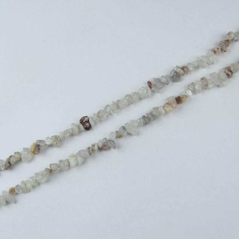 Single natural cherry blossom agate irregular bead necklace laid flat on light surface, 31-inch length with organic round beads in soft pink and cream