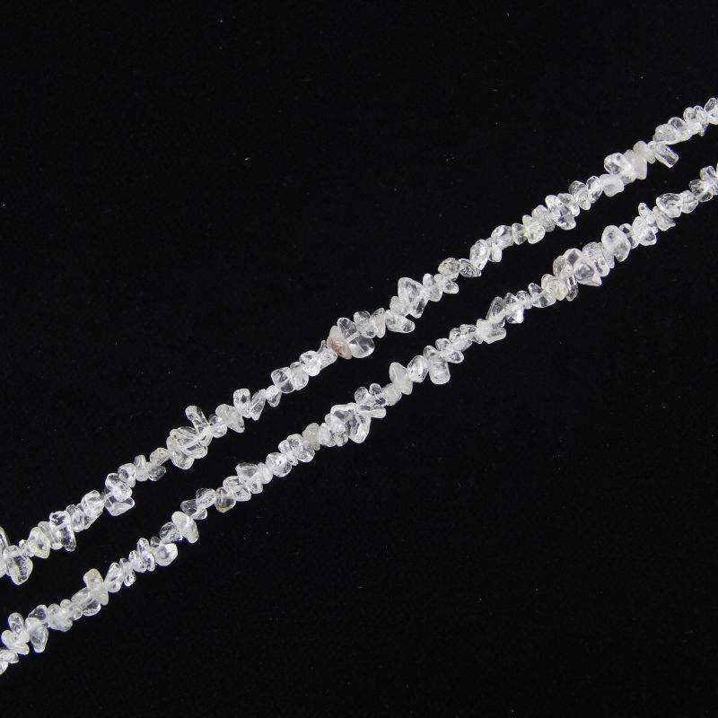 single flat lay of clear quartz necklace strand, 31.5 inches, 5-8mm irregular round beads strung on nylon cord