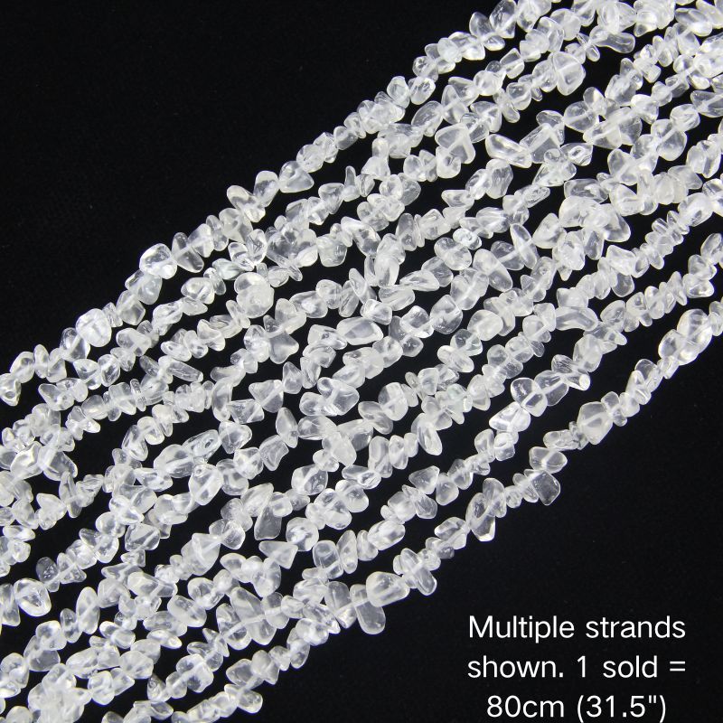 Multiple strands of 31.5" clear white irregular glass chip beads (5-8mm) displayed on a dark background. Note: 1 strand sold per order, measuring 80cm (31.5").