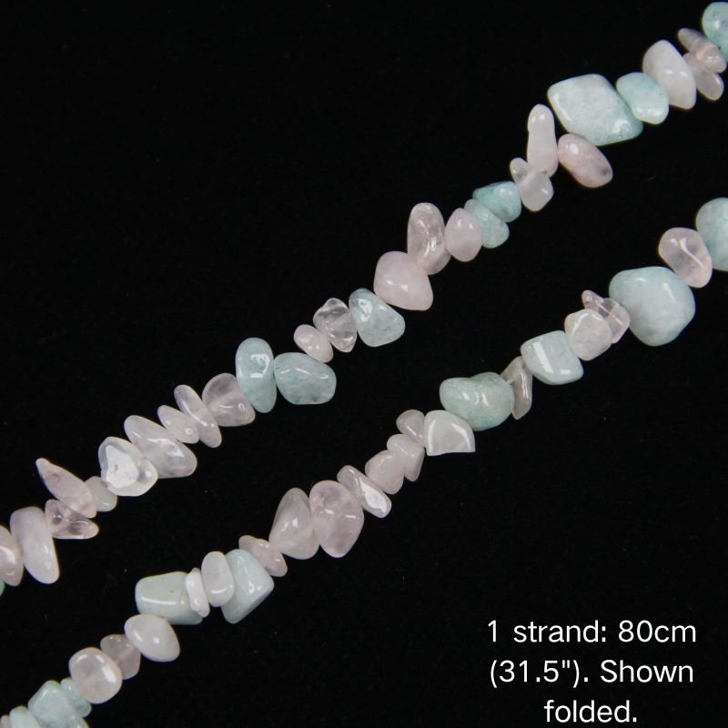 Close-up of 5-8mm irregular pastel pink and blue quartz stone chips with a smooth polish, strung on nylon cord.