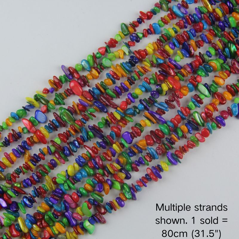 Multiple strands of 31.5" Colorful dyed shell chips (5-8mm) displayed as the cover image. Note: 1 strand sold per order.