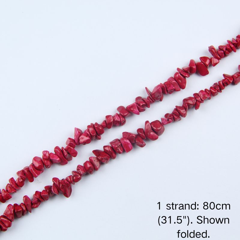 Dyed red howlite chip beads strand folded, 31.5 inches, nylon cord, warm red and white veining pattern.
