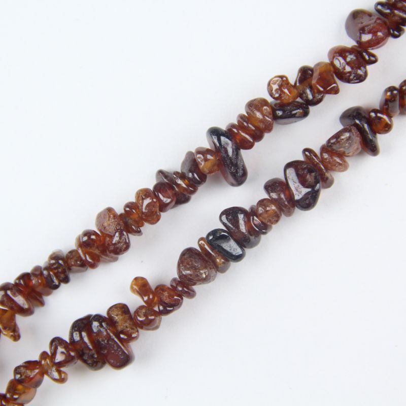 Close-up of Fanta Garnet stone texture, orange spessartine garnet with natural inclusions