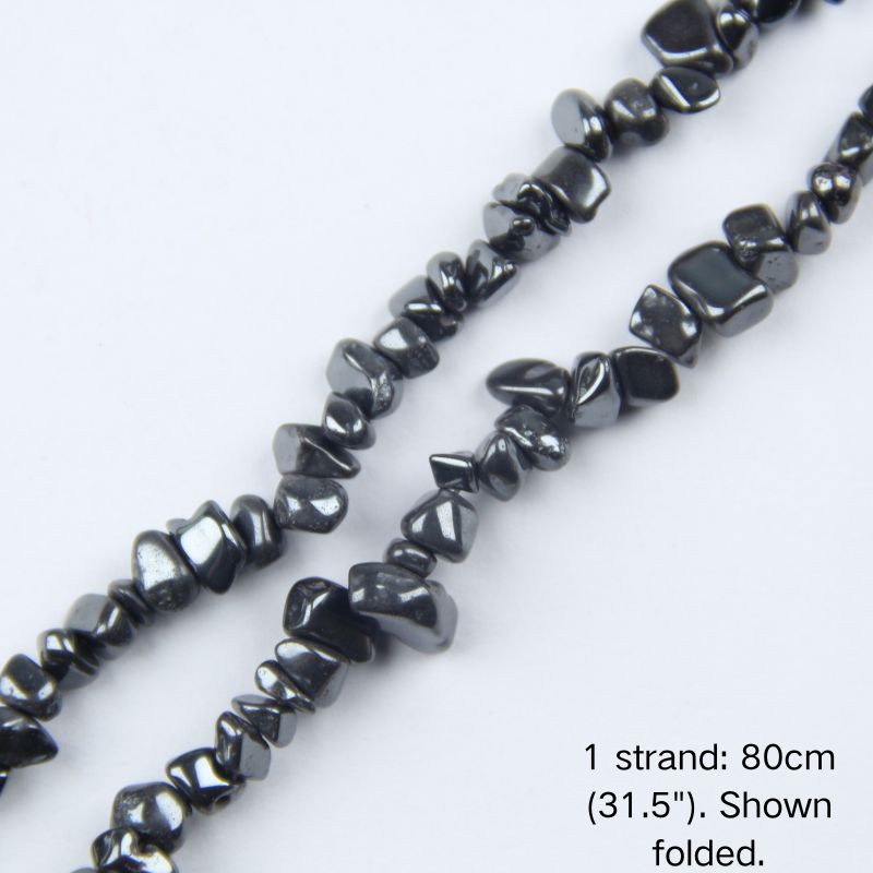 Close-up of a single folded strand of natural black Hematite irregular chips, showing the polished gunmetal metallic shine on 5-8mm stone gravel strung on nylon cord.