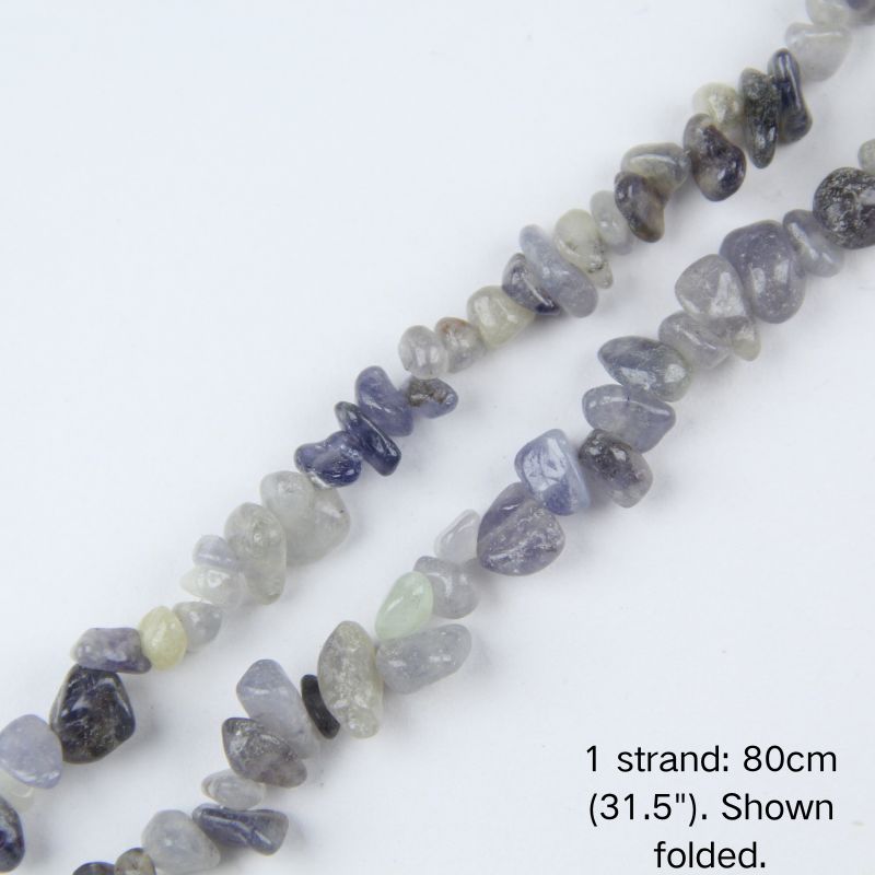 Close-up of a single folded strand of natural Iolite irregular chips, 5-8mm gravel beads with natural blue and grey tones