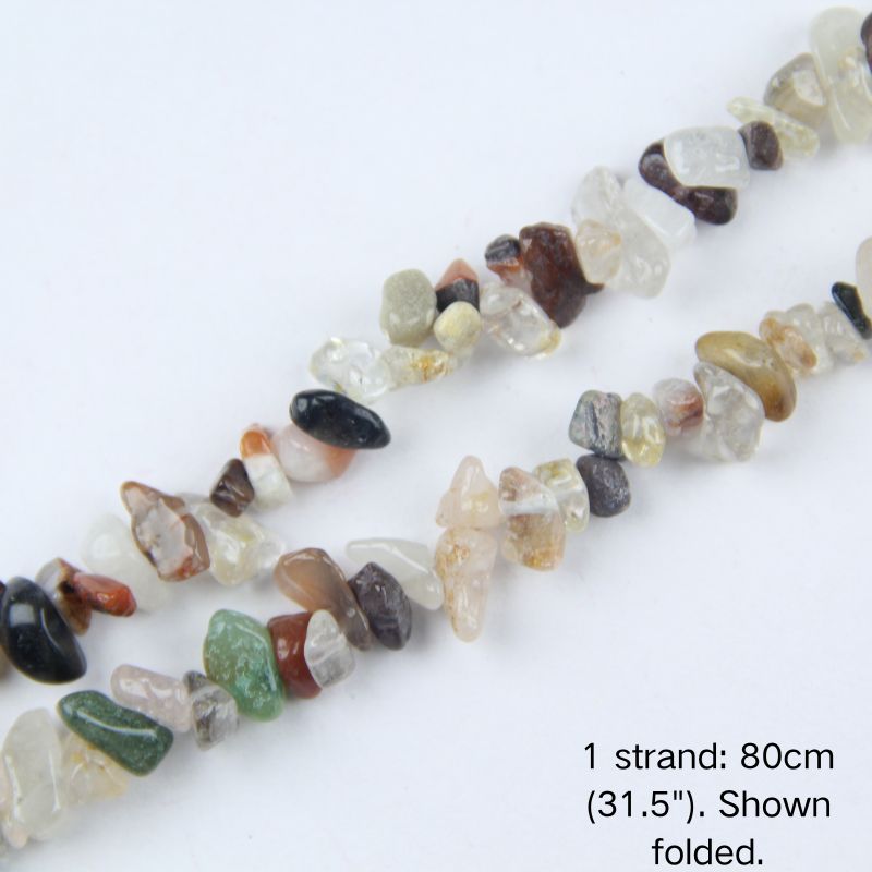 Close-up of a folded mixed gemstone chip bead strand, showing polished multi-color gravel in 5-8mm sizes including clear quartz, green, black, and brown.
