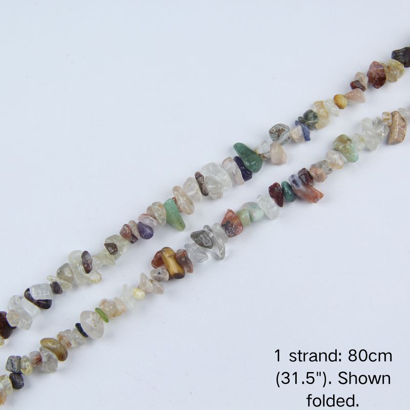 Single strand of mixed natural gemstone gravel beads folded on a white background, pre-strung on nylon cord for DIY jewelry making.