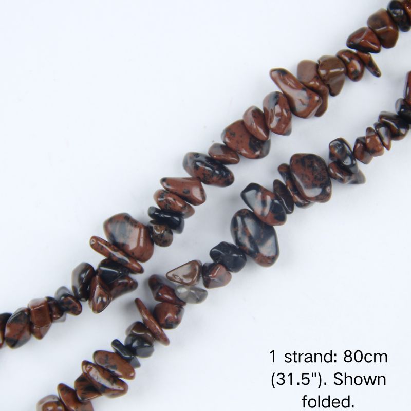 Macro close-up of 5-8mm Golden Obsidian chip beads, showing glossy volcanic glass texture, golden sheen reflections, and center-drilled holes.
