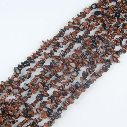 31.5 inch golden swan obsidian irregular bead necklace laid flat on white background showing rich gold sheen on black stone
