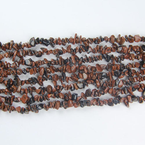multiple golden swan obsidian long necklaces laid side by side on white background comparing gold sheen across strands