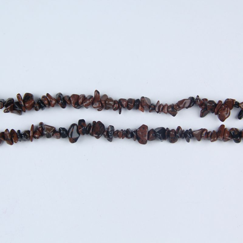 single strand golden swan obsidian irregular bead long necklace laid flat on white background showing rich gold sheen on black stone
