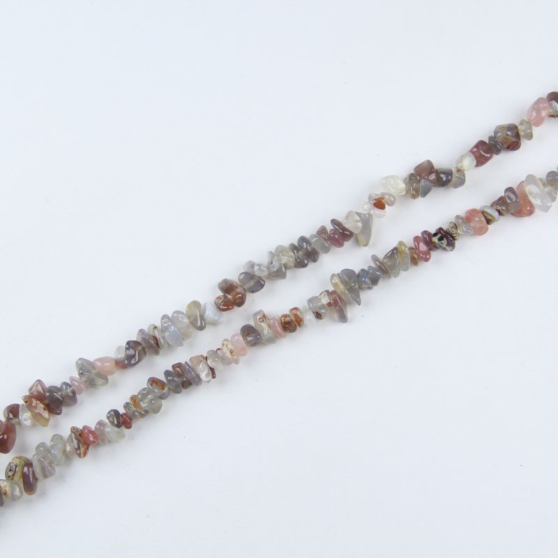 Single natural grey agate irregular bead necklace laid flat on light surface, 31-inch length with organic round beads
