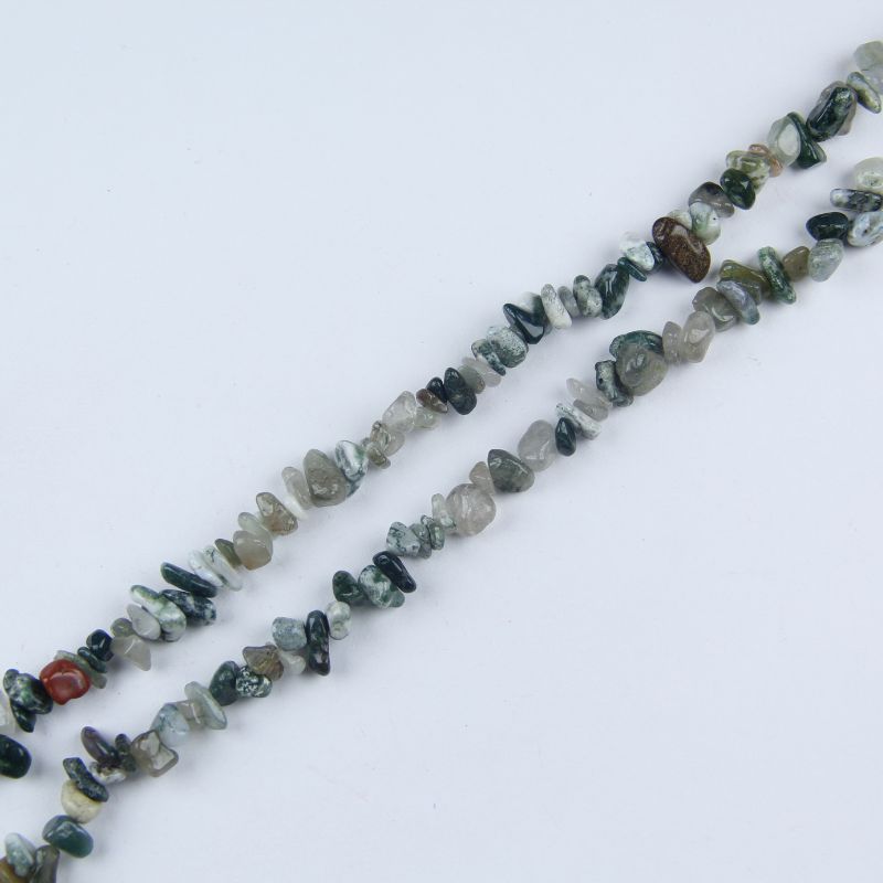 Single natural Indian agate irregular bead necklace laid flat on linen, 31-inch length with organic round beads in brown, cream, and rust
