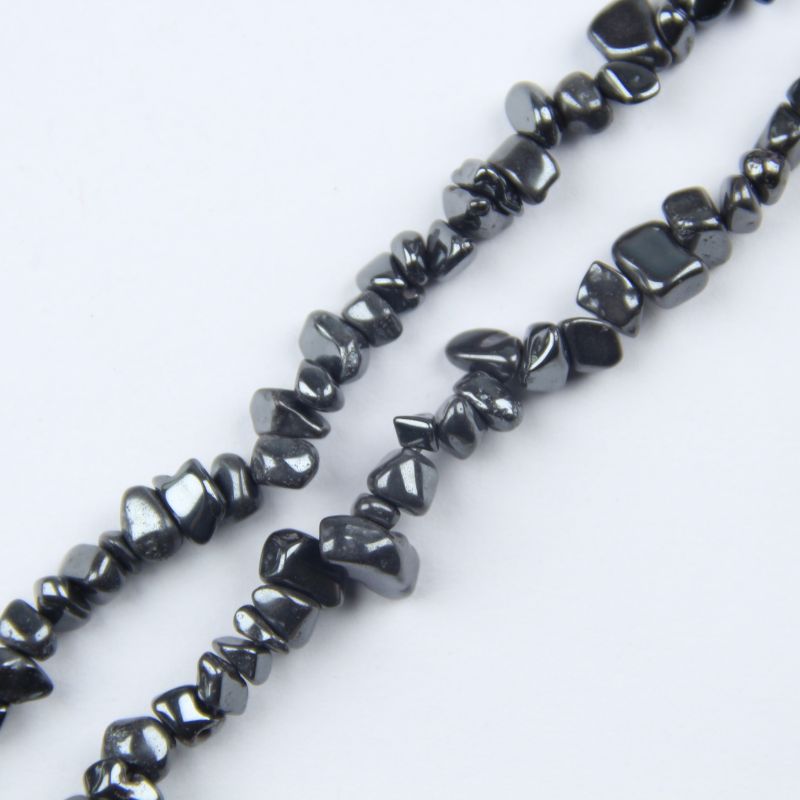 Close up of natural iron stone bead strand, 31.5 inch length, irregular 5-8mm gray-black magnetic hematite chips with metallic luster