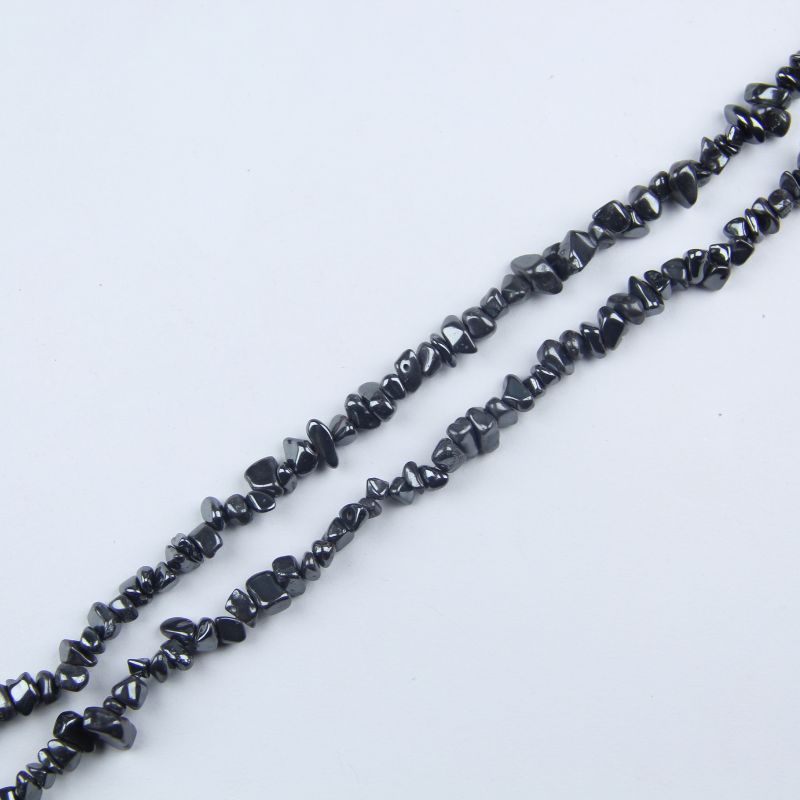 Close up of natural iron stone bead strand, 31.5 inch length, irregular 5-8mm gray-black magnetic hematite chips with metallic luster