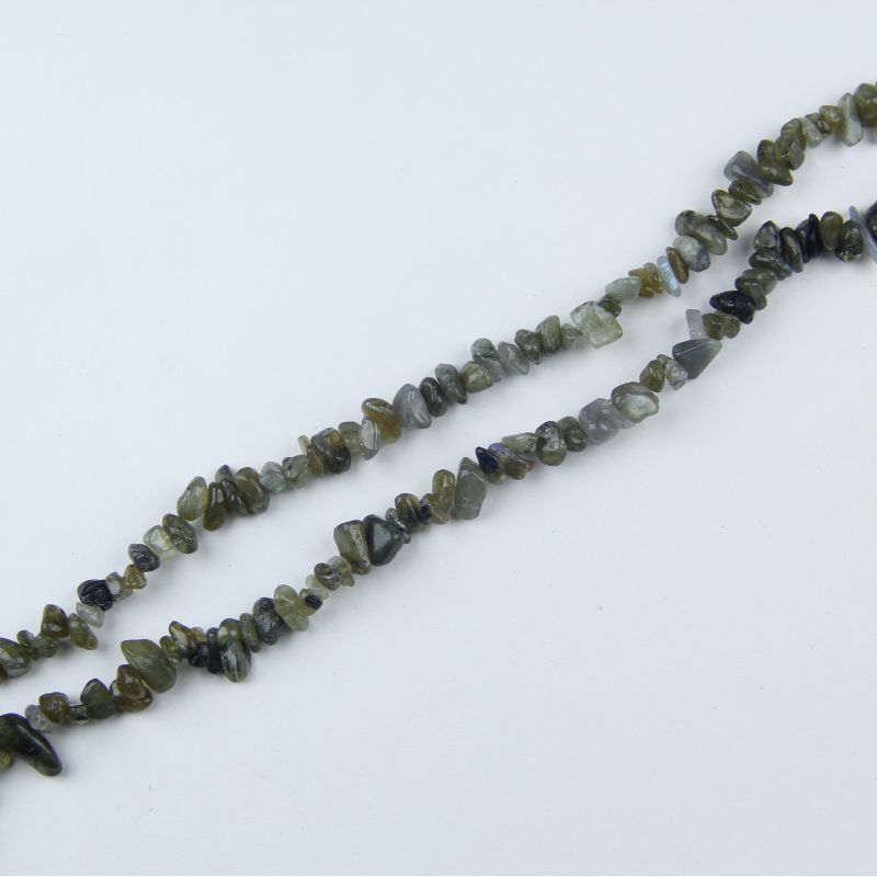Flat lay of labradorite beads, natural spectrolite gemstones with blue-green flash