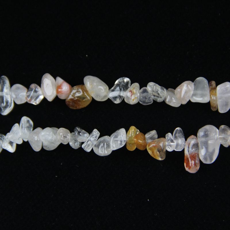 macro closeup of light pink floral inclusion quartz bead showing delicate pink flower-like patterns