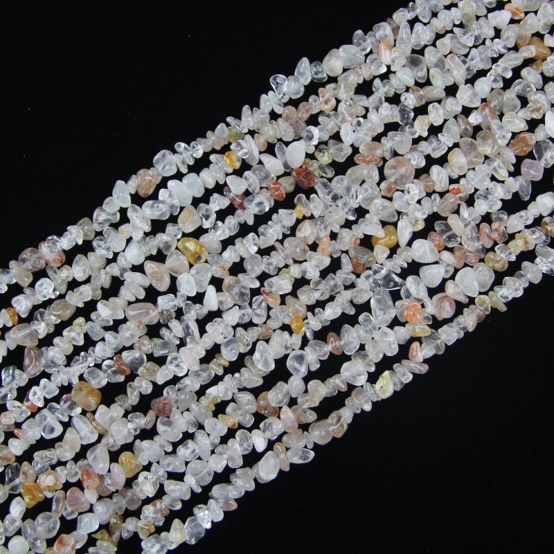 31.5 inch light pink floral inclusion quartz irregular bead necklace laid flat on white background showing soft pink inclusions