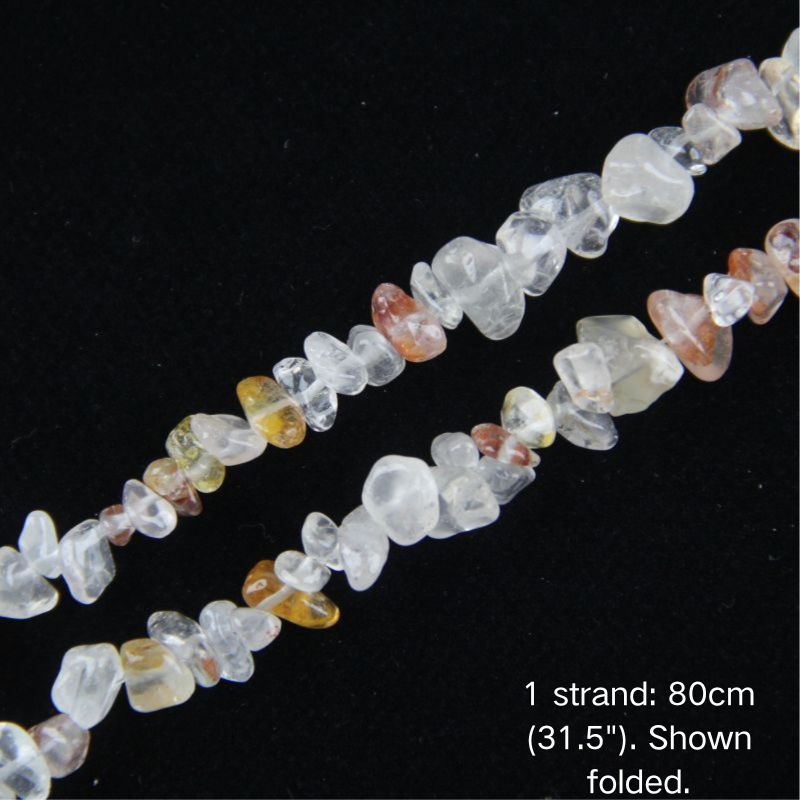 Macro close-up of 5-8mm Light Red Hematoid Quartz chip beads, showing polished translucent crystal, delicate pinkish-red iron inclusions, and center-drilled holes.