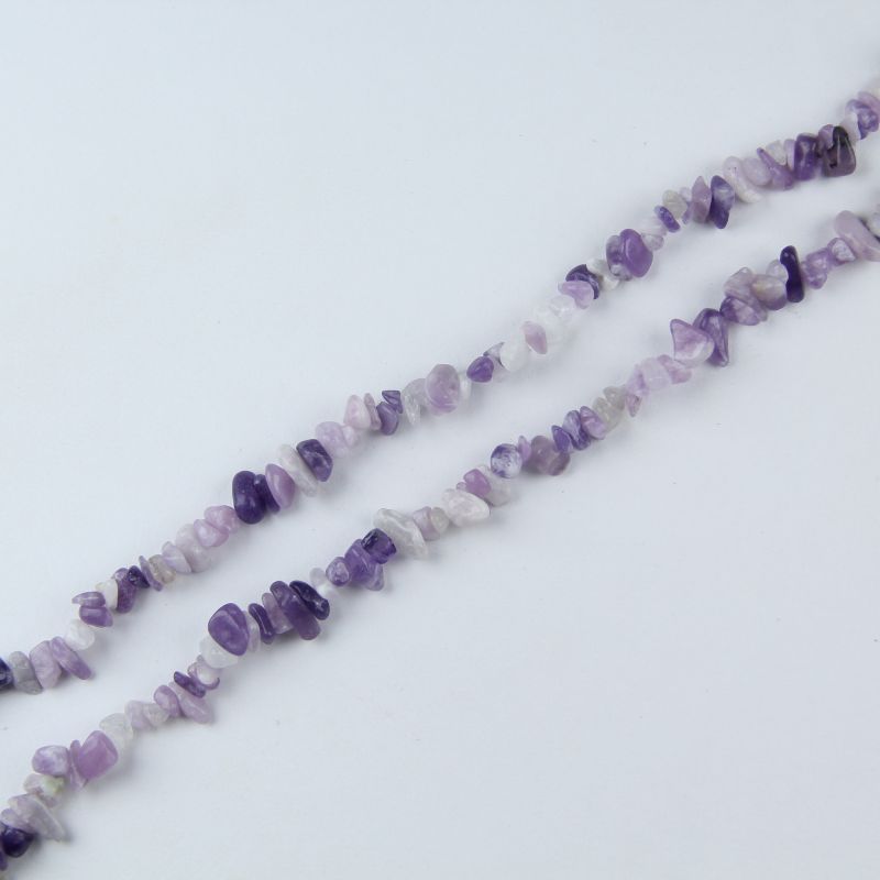 single flat lay of lilac crystal necklace strand, 31.5 inches, 5-8mm irregular round beads strung on nylon cord