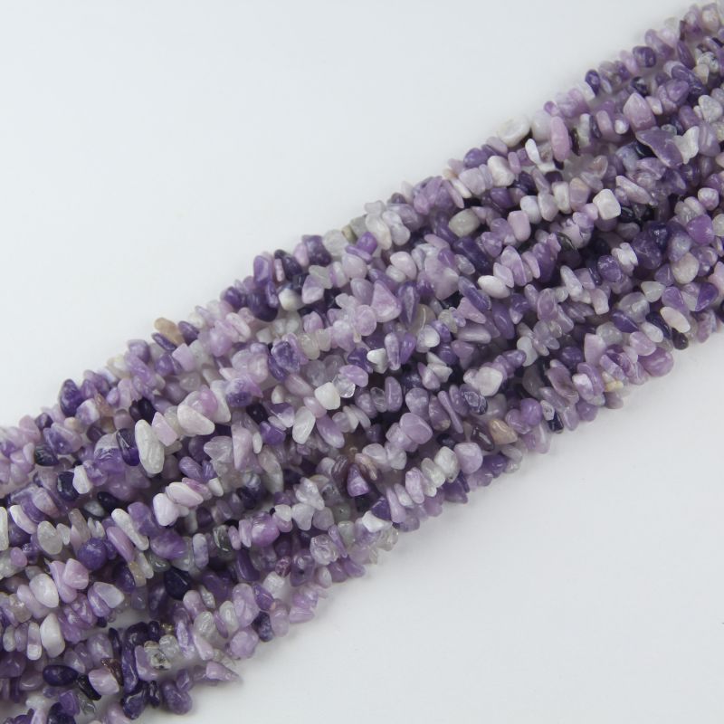 stacked coils of lilac crystal bead strand, 31.5 inches long, irregular round 5-8mm beads on nylon cord