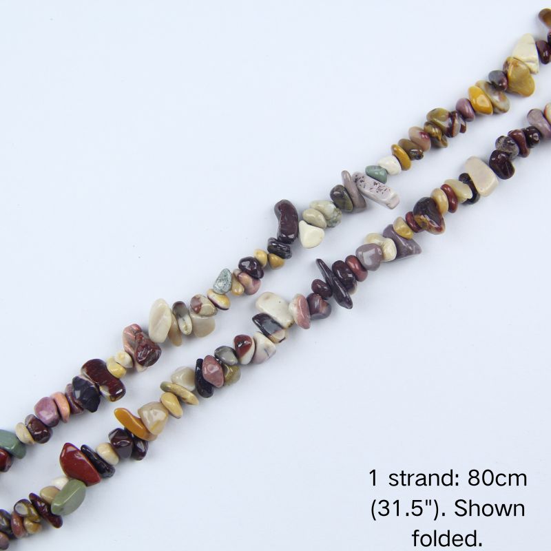 Mixed agate and jasper chip beaded strand, 31.5 inch (80cm) length shown folded on white background.