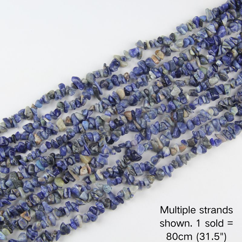 Multiple strands of natural mixed blue gemstone chips, deep blue with cream and earthy tones, 31.5 inch beaded cord. 1 sold equals 1 strand.