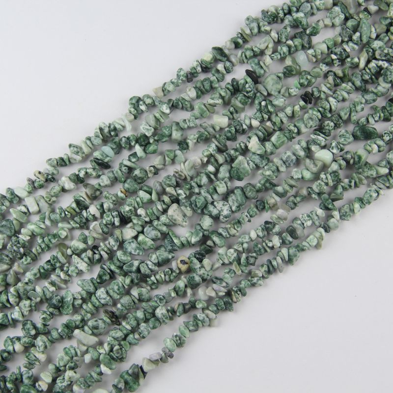 Natural tree agate irregular bead long necklace on white background, milky white beads with black and deep green dendritic tree-like patterns on each freeform bead
